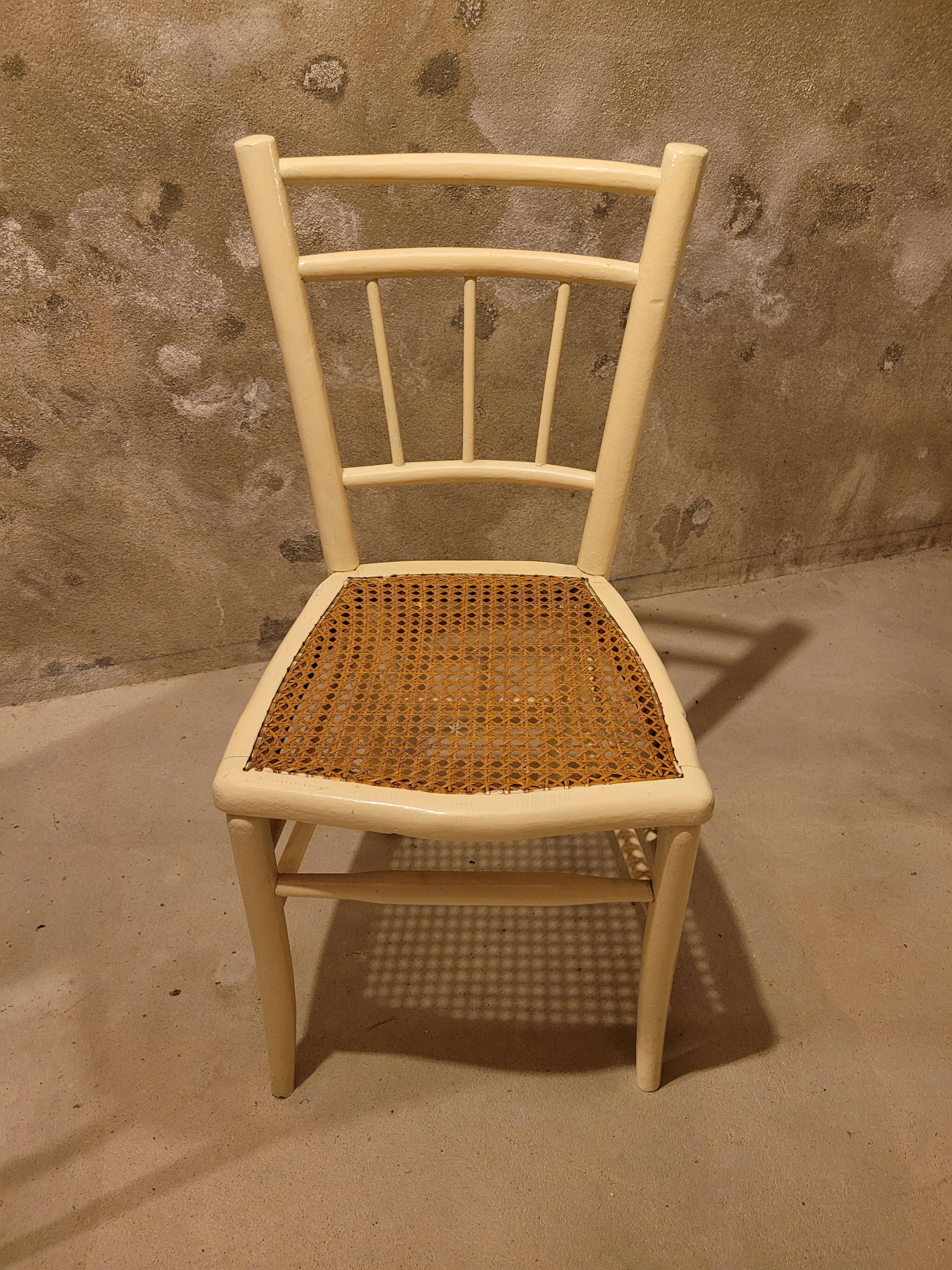 2 white wooden chairs