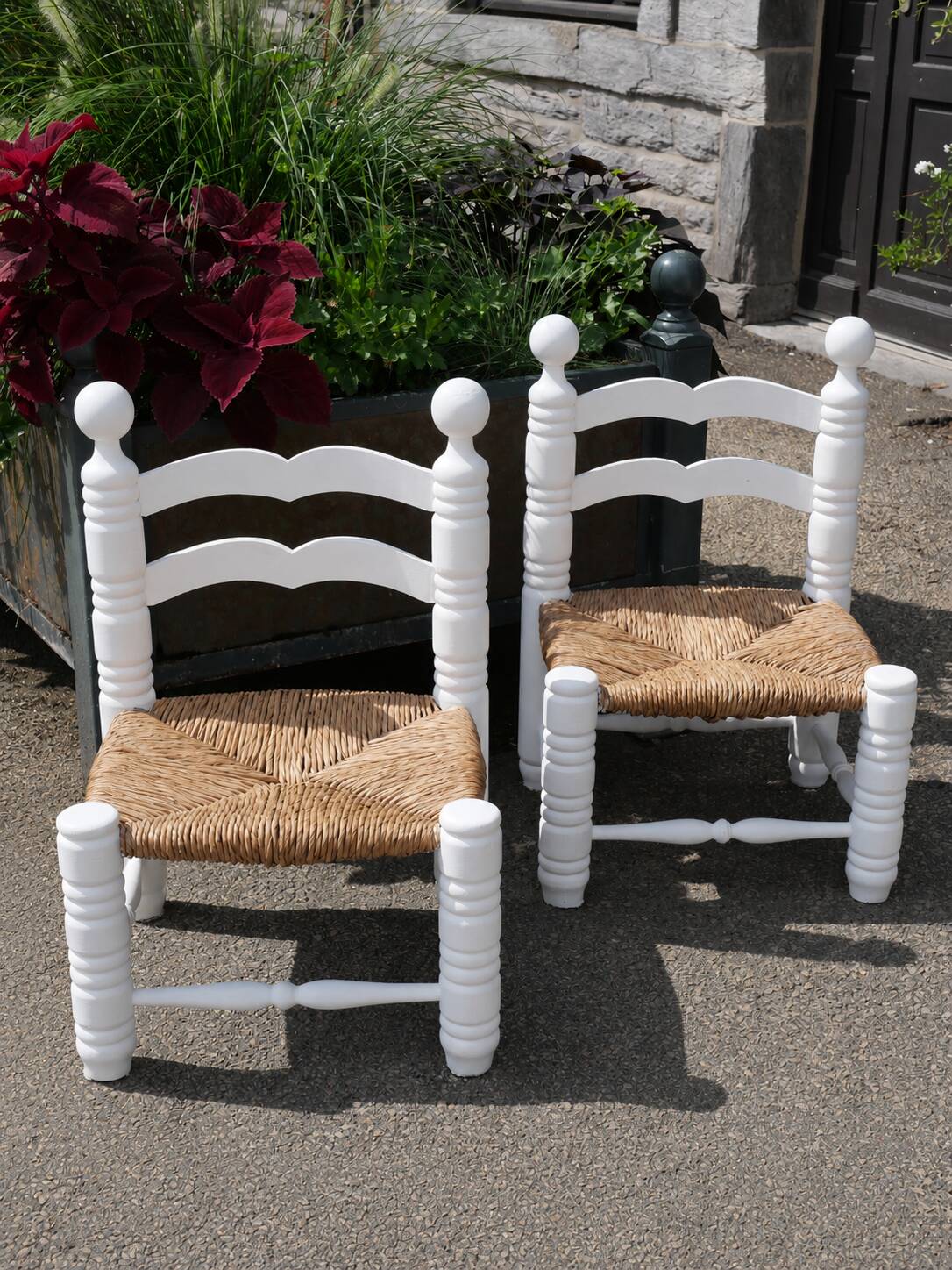 Pair of rush-seated chairs by Charles Dudouyt