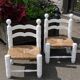 Pair of rush-seated chairs by Charles Dudouyt