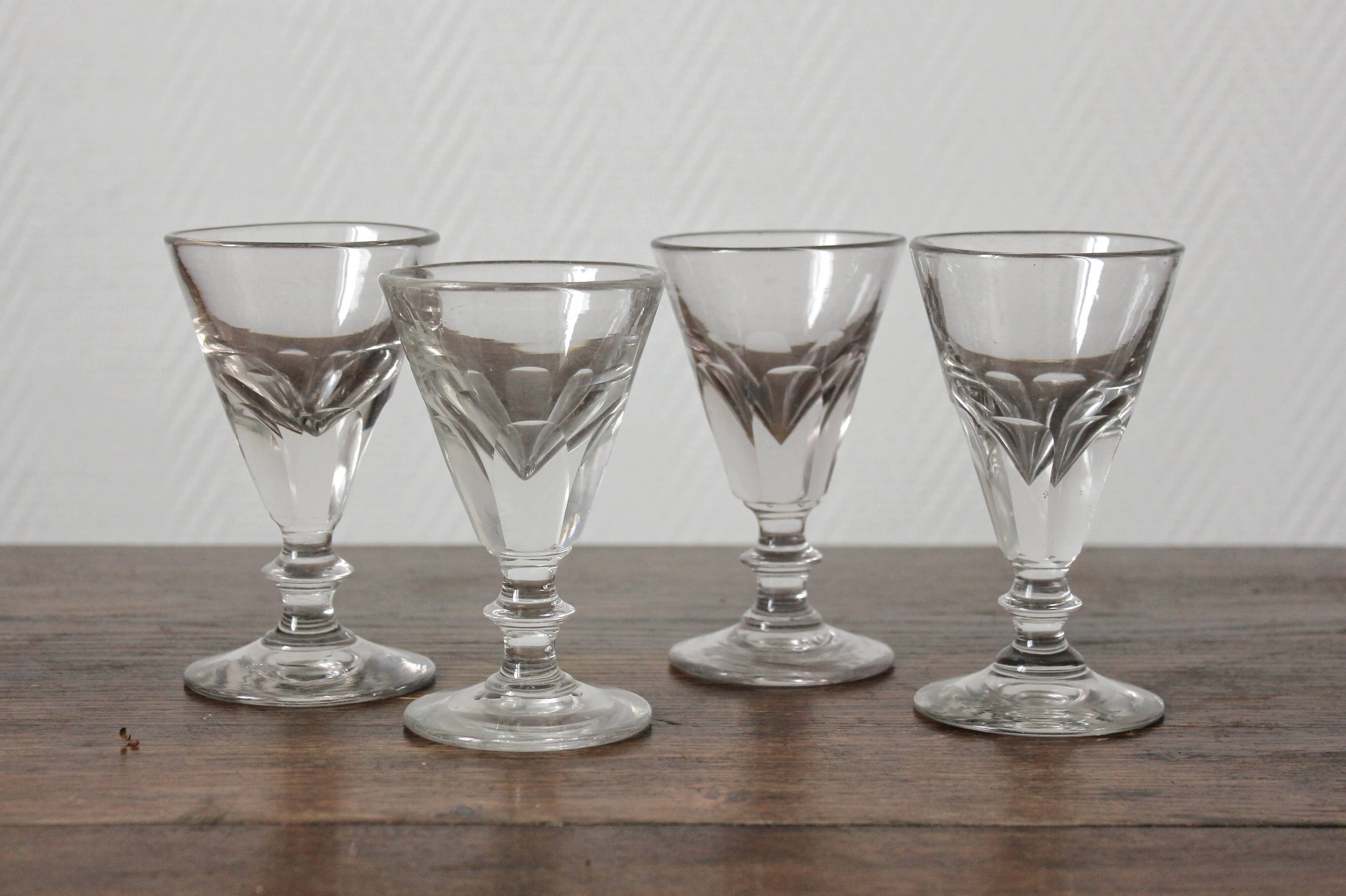 4 antique stemmed wine glasses with flat sides, made of blown glass from the 19th century