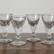 4 antique stemmed wine glasses with flat sides, made of blown glass from the 19th century
