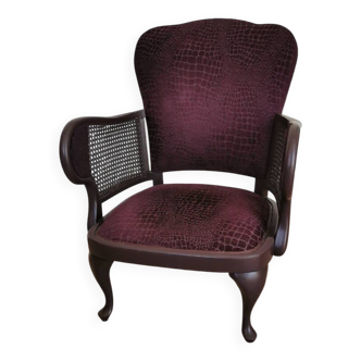 Upholstered armchair with canework