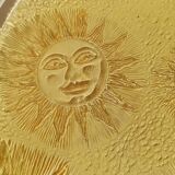 Glass plate decorated with suns, 1980.