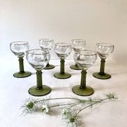 7 Alsace Roemer wine glasses, moss green stepped bases and gold trim.
