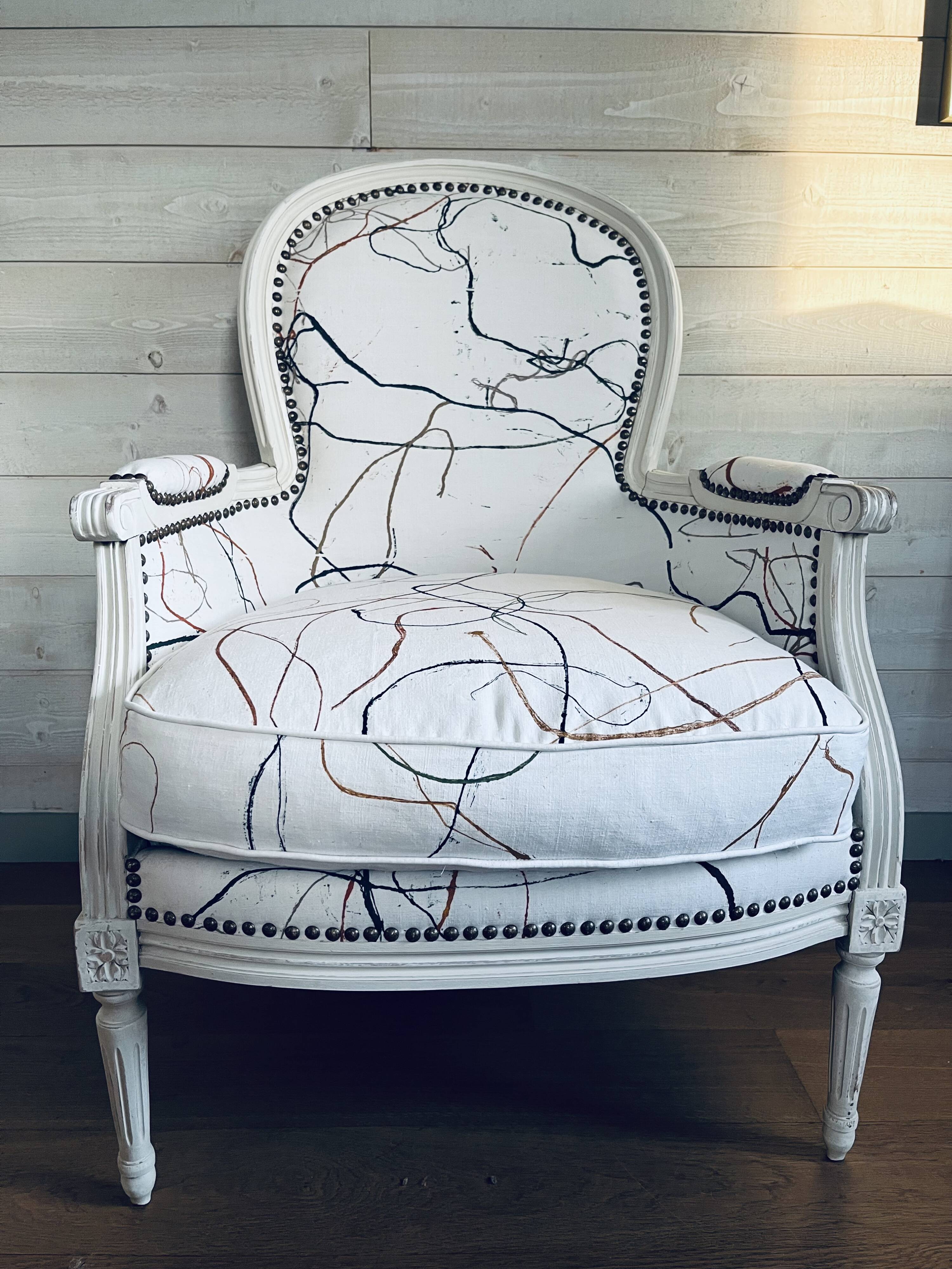 Shepherdess reupholstered with old linens by Sophie de Garam