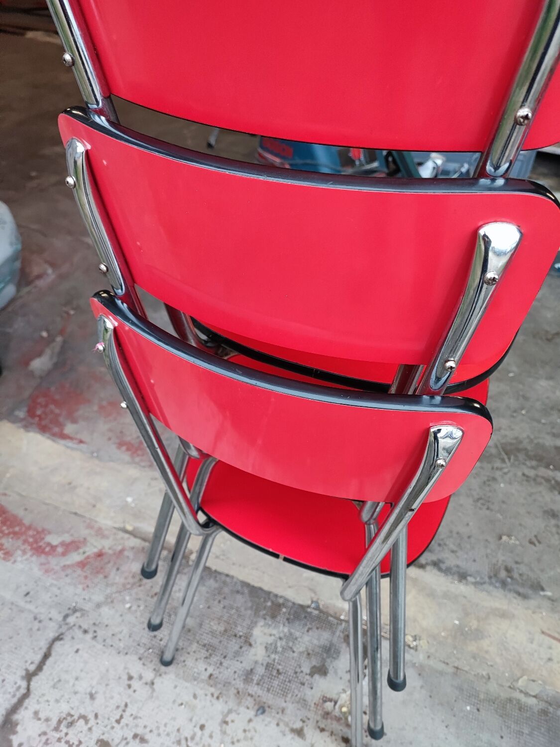 6 red and chrome Formica chairs