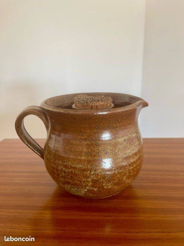 Large antique brown glazed stoneware jug with cork stopper.