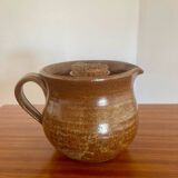 Large antique brown glazed stoneware jug with cork stopper.