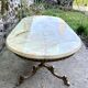 Oval coffee table in onyx and gilded brass in the Louis XVI style.