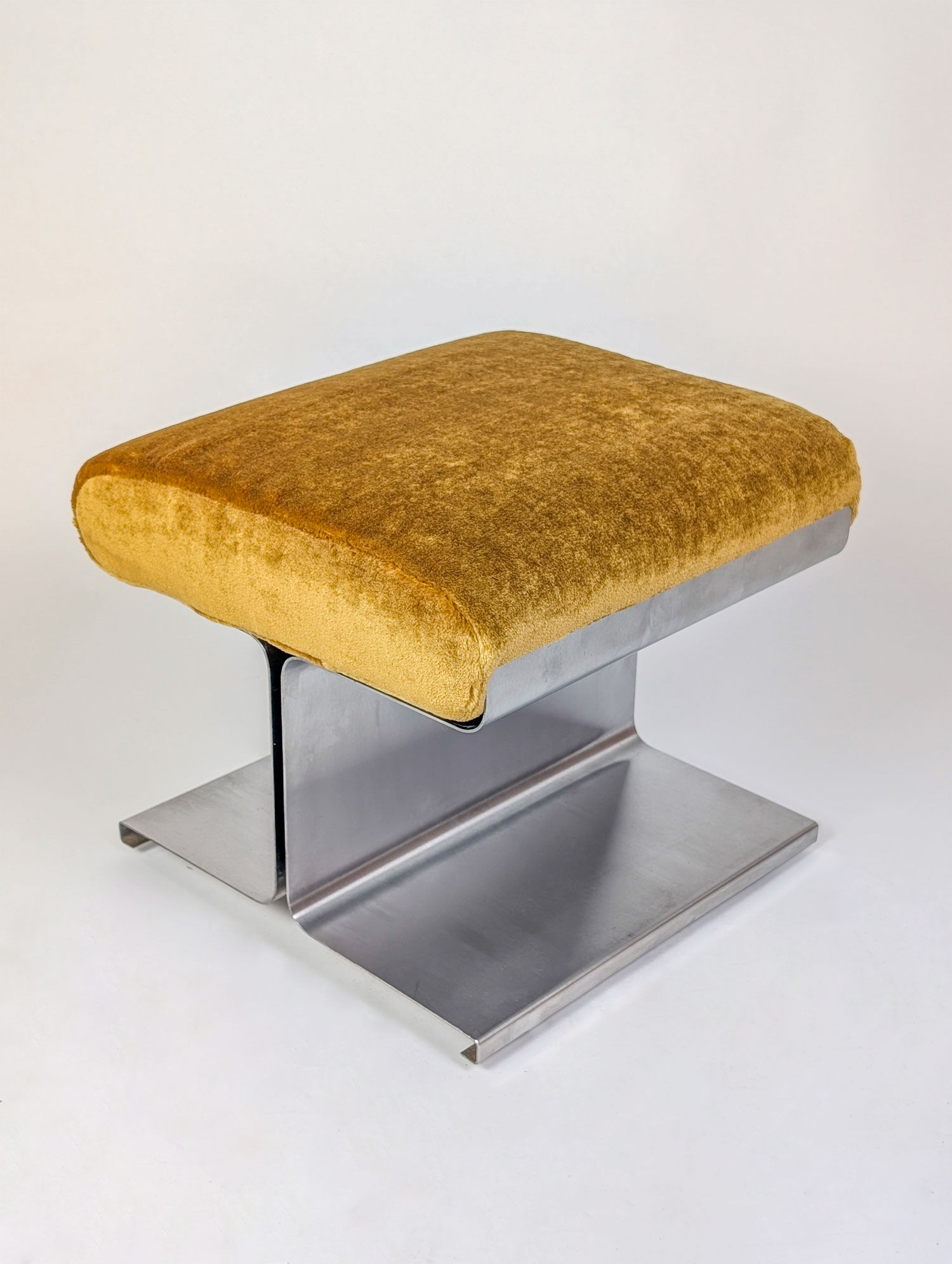 Stainless steel coffee table and stool, by the Roche Bobois design office, 1970