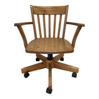 Solid wood swivel and reclining armchair.