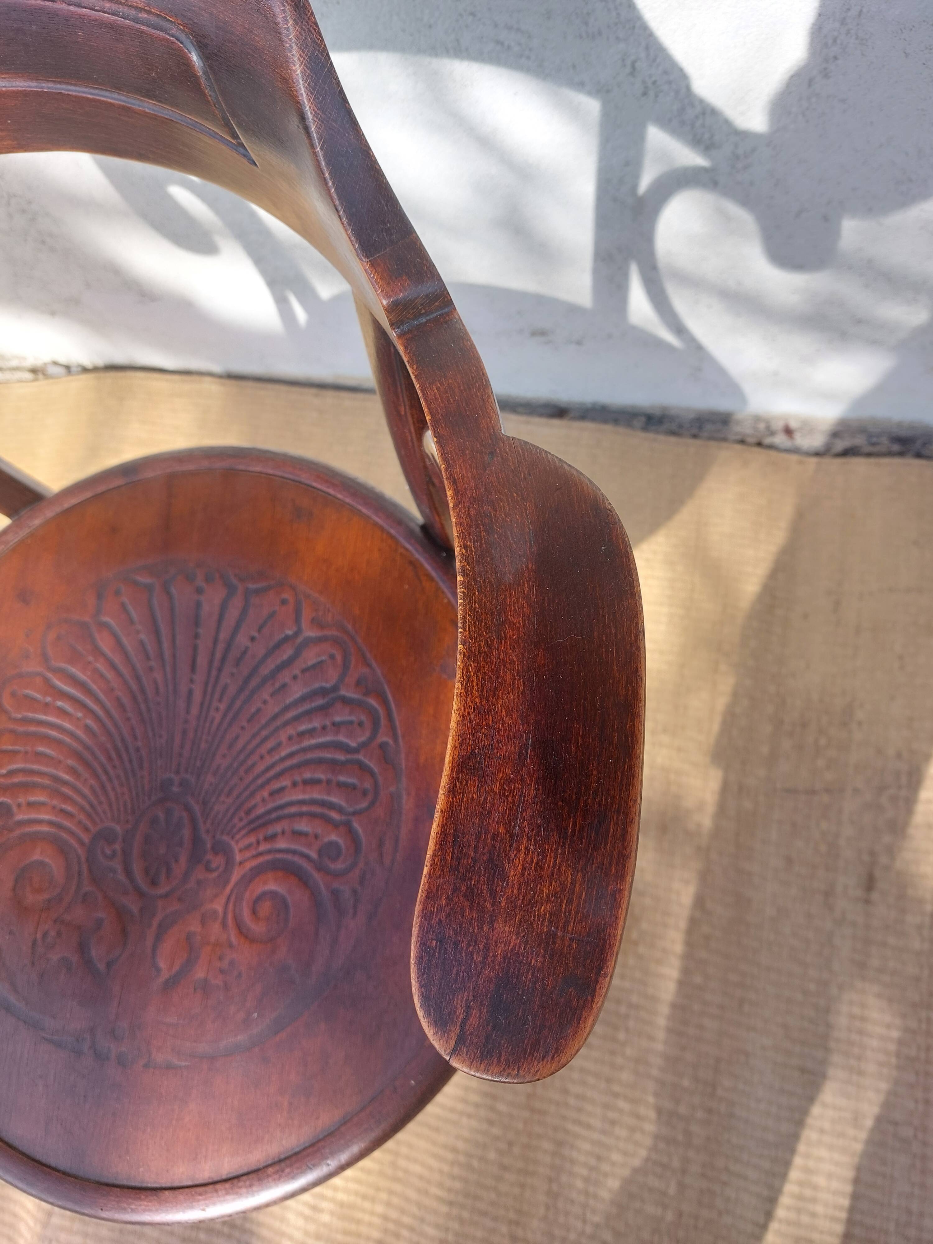 Swivel wooden armchair, pattern on seat