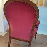 Red voltaire armchair