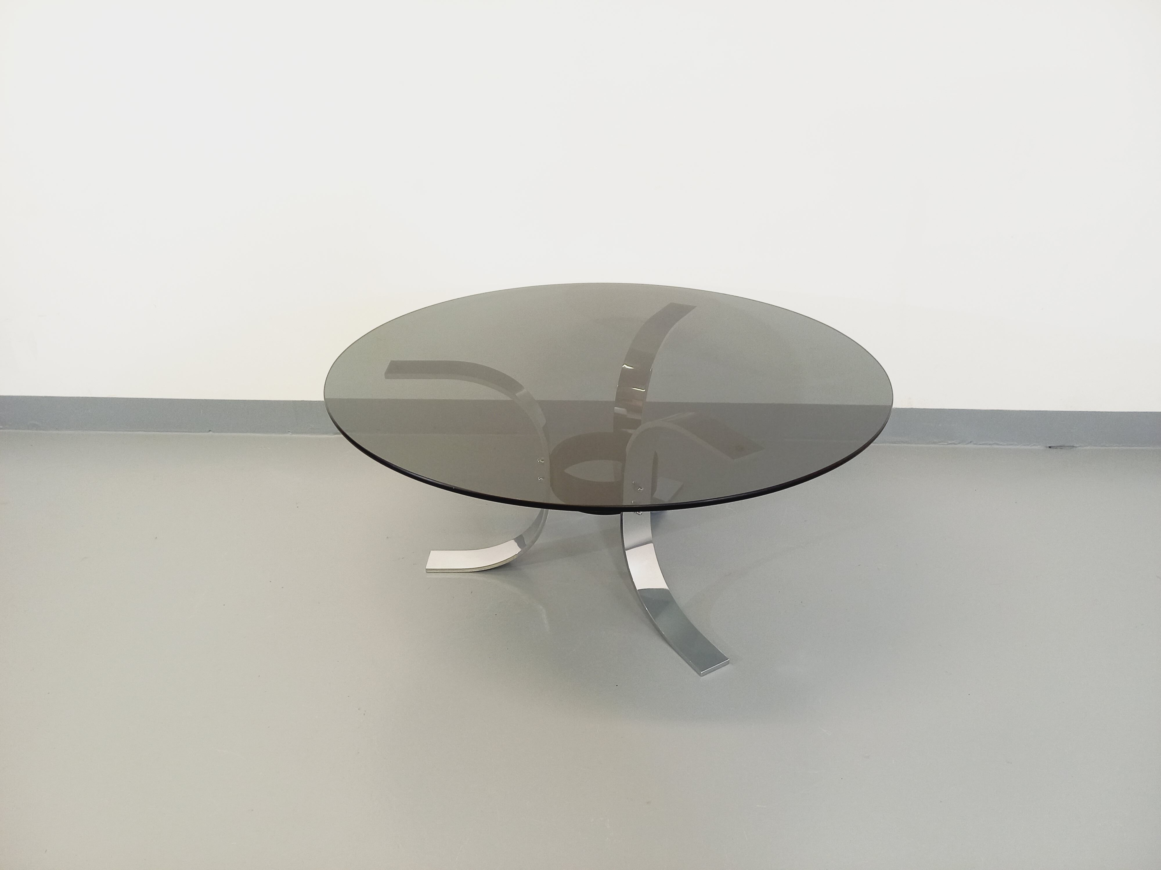 Vintage round coffee table in glass, chromed metal and black metal Space Age style of the 70s