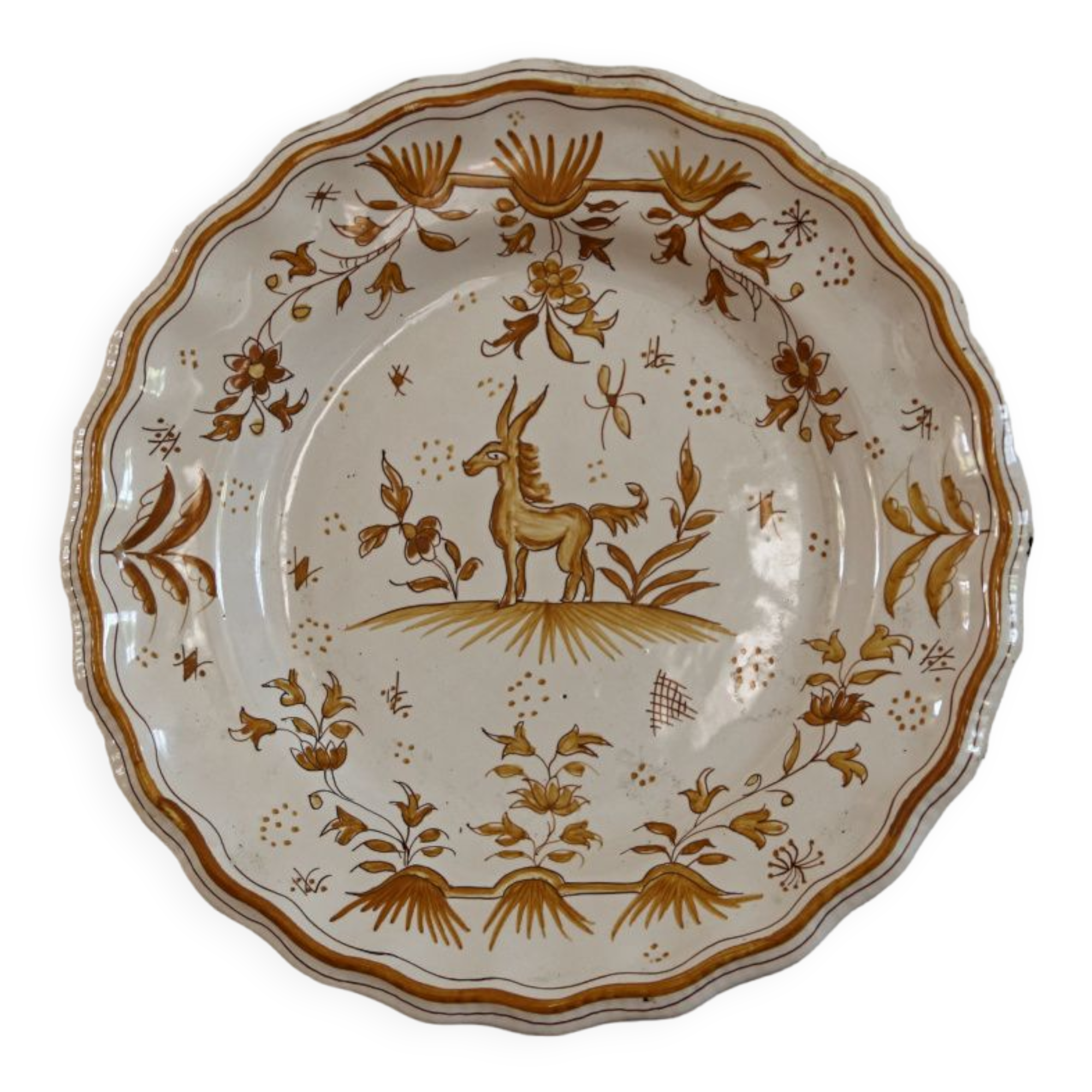 Signed Moustiers plate, in yellow shades