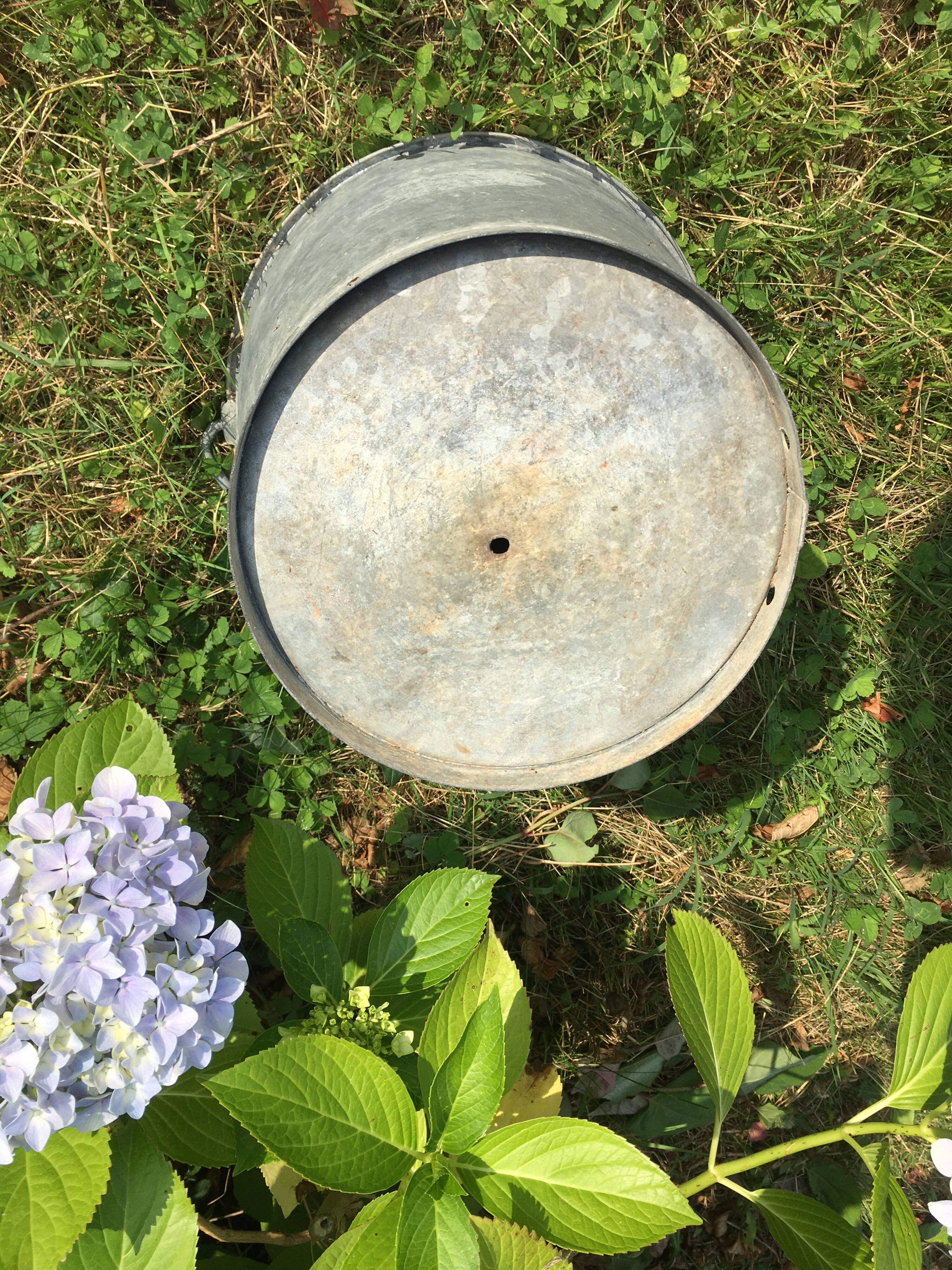 Old bucket in vintage zinc pot cache