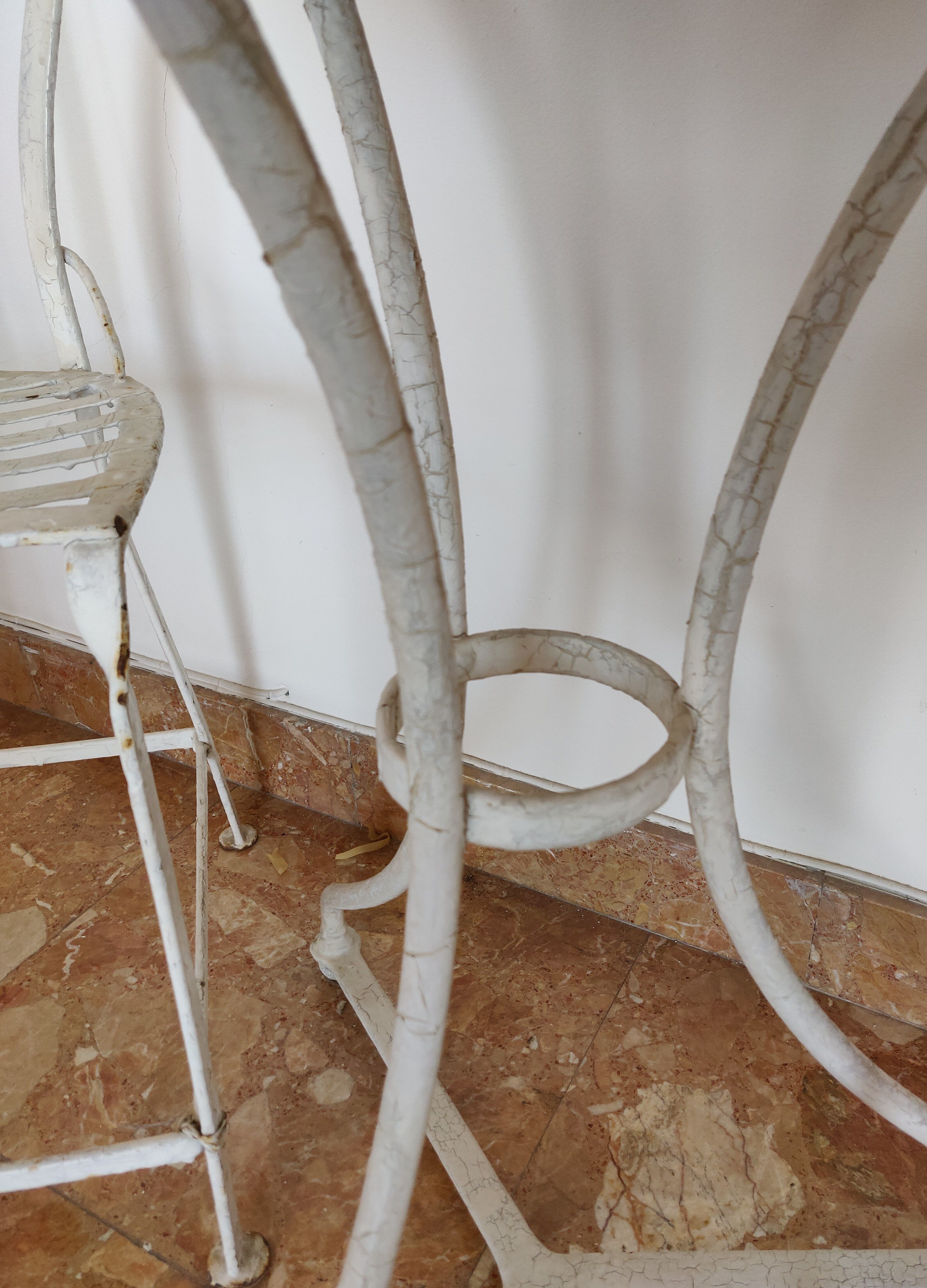 Table and bistro chairs wrought iron terrace