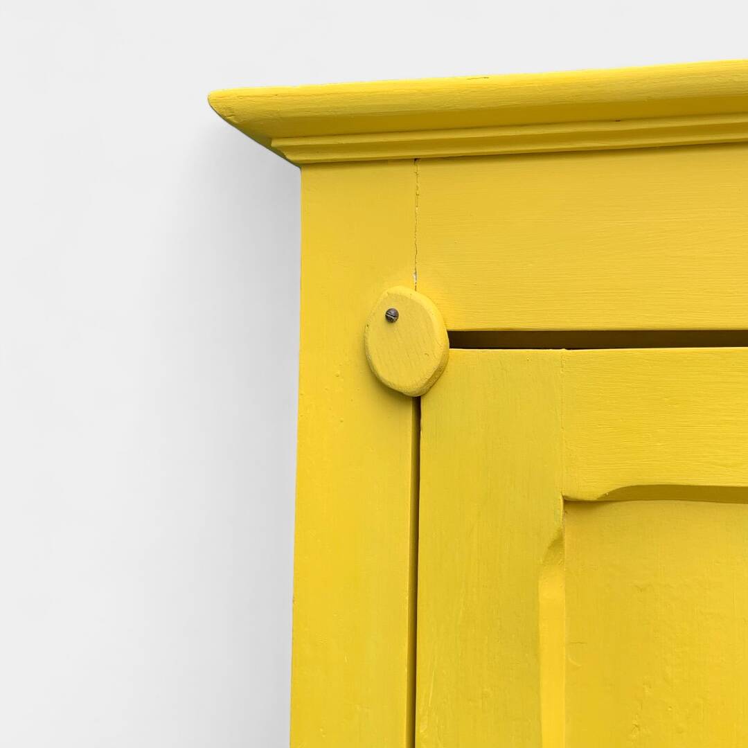 Antique powder yellow Parisian bonnetière wardrobe.