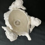 Porcelain, centerpiece with candle holder decorated with putti, 20th century