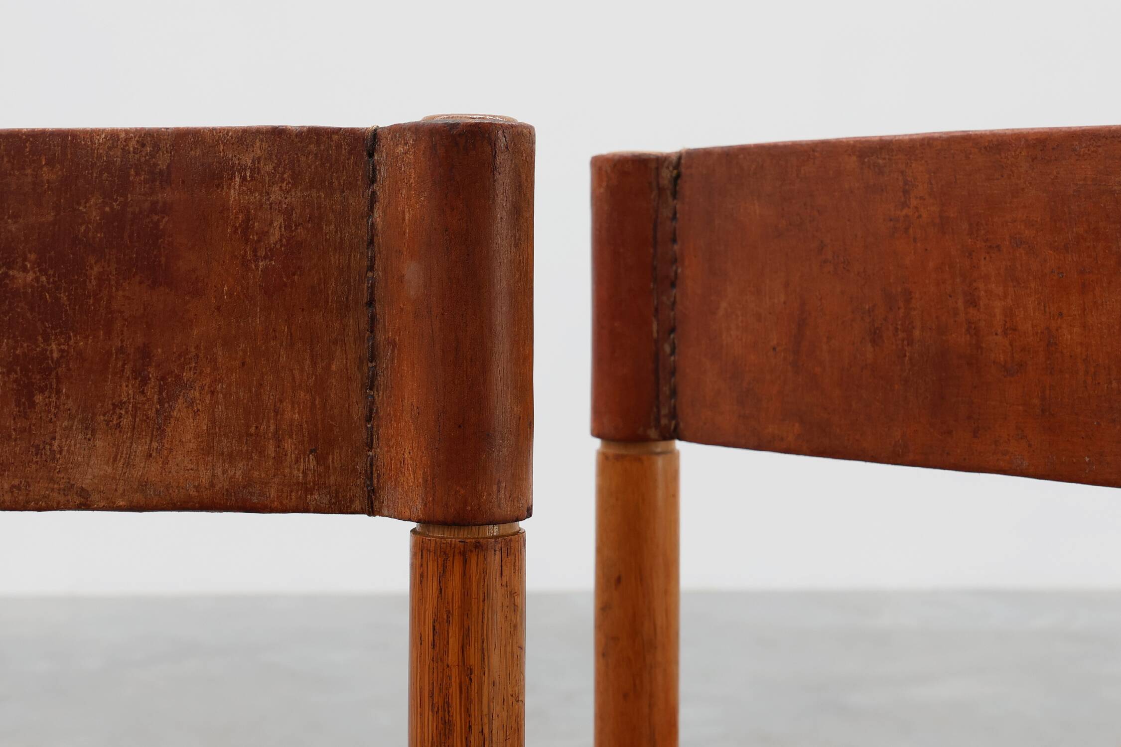 Pair of wood and leather Spanish chairs by Jordi Vilanova, ca. 1960