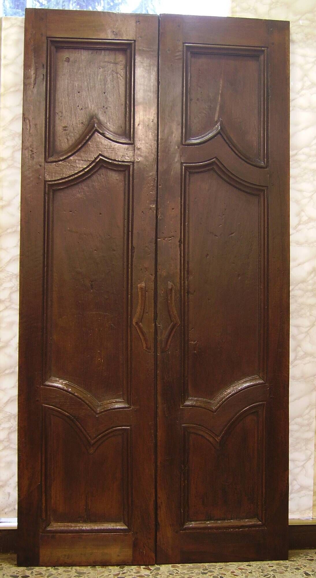 Pair of antique solid walnut doors from the 18th century.
