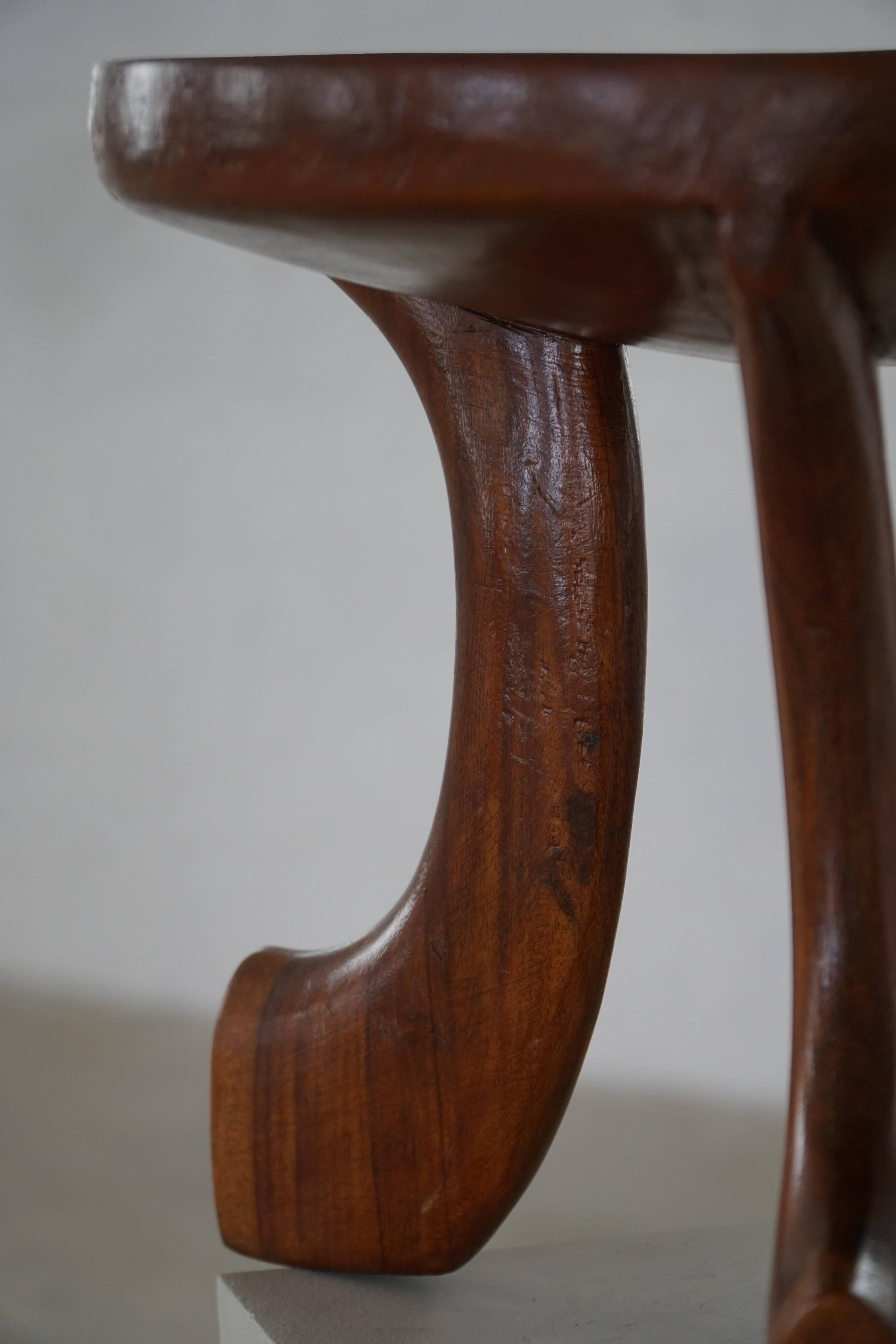 Oromo stool from mid-20th century Africa, hand-carved wood, tribal style.