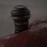 Dark red upholstered camel saddle stool, 20th century, North Africa.