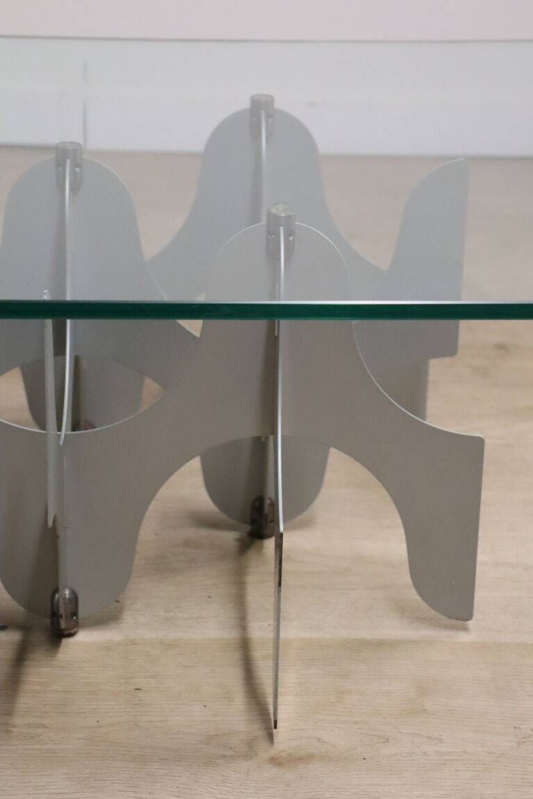 Minimalist sculptural coffee table in metal and glass