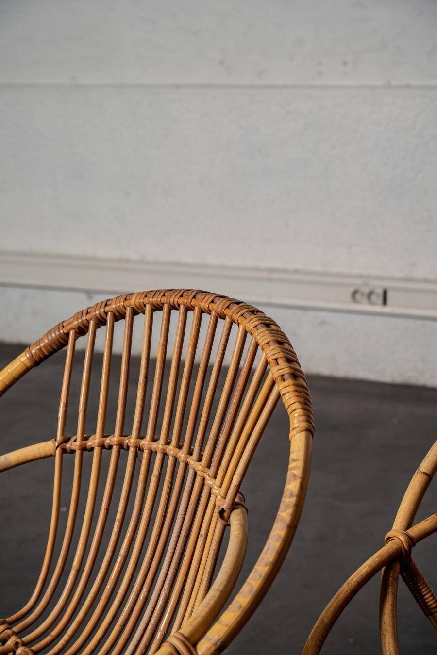 Rattan armchair with metal legs