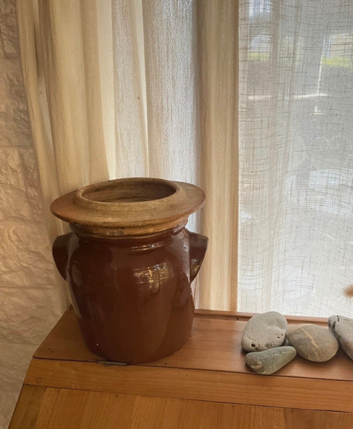 Ancient ceramic salt cellar and its lid.