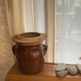 Ancient ceramic salt cellar and its lid.