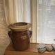 Ancient ceramic salt cellar and its lid.