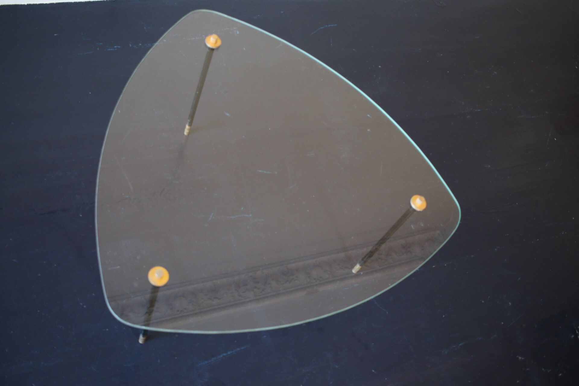 Vintage glass and black-painted brass side table
