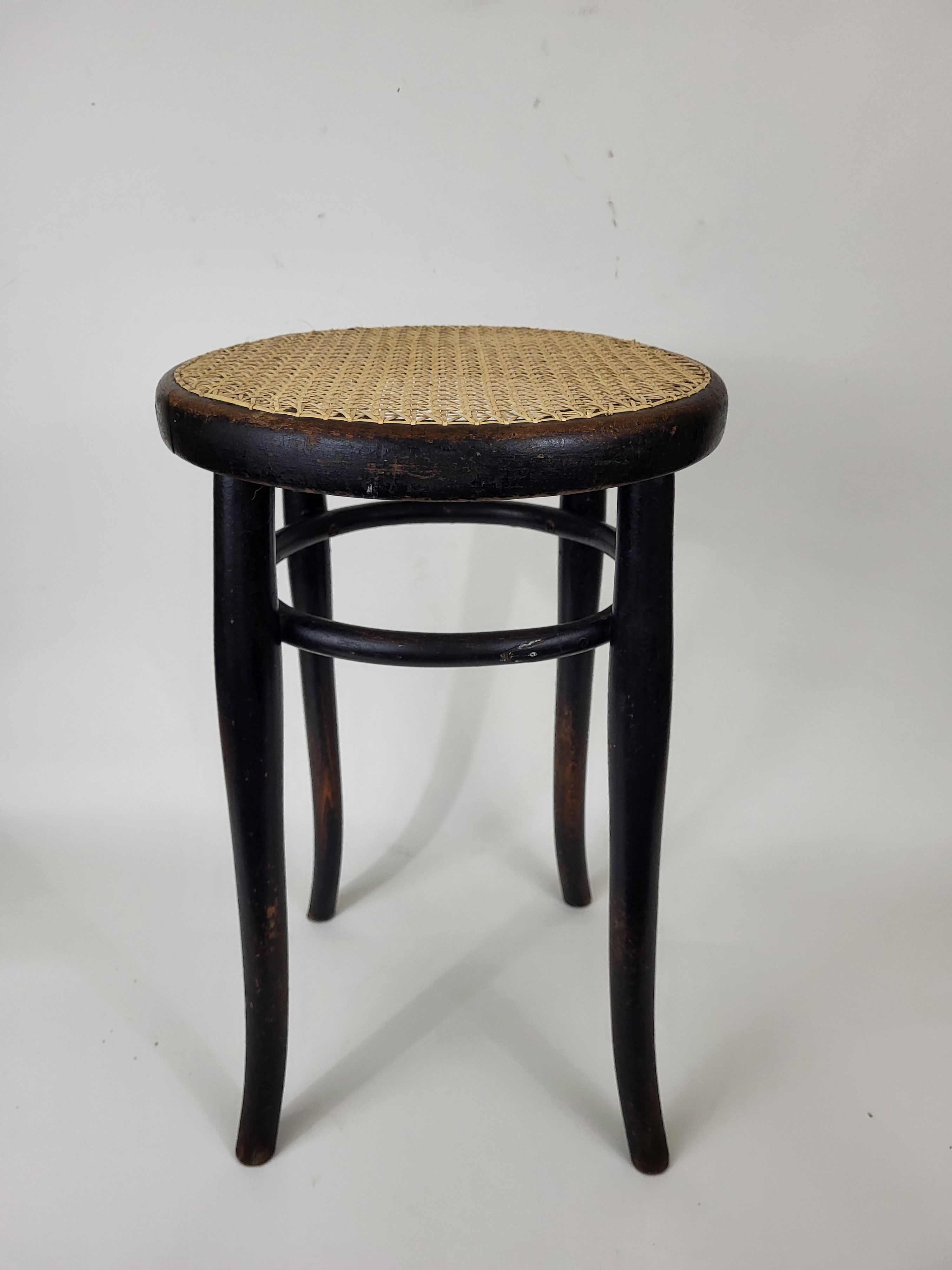 Blackened curved wooden stool Thonet