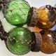 Fishing floats made of blown glass, cork, and rope. France, 1960s.
