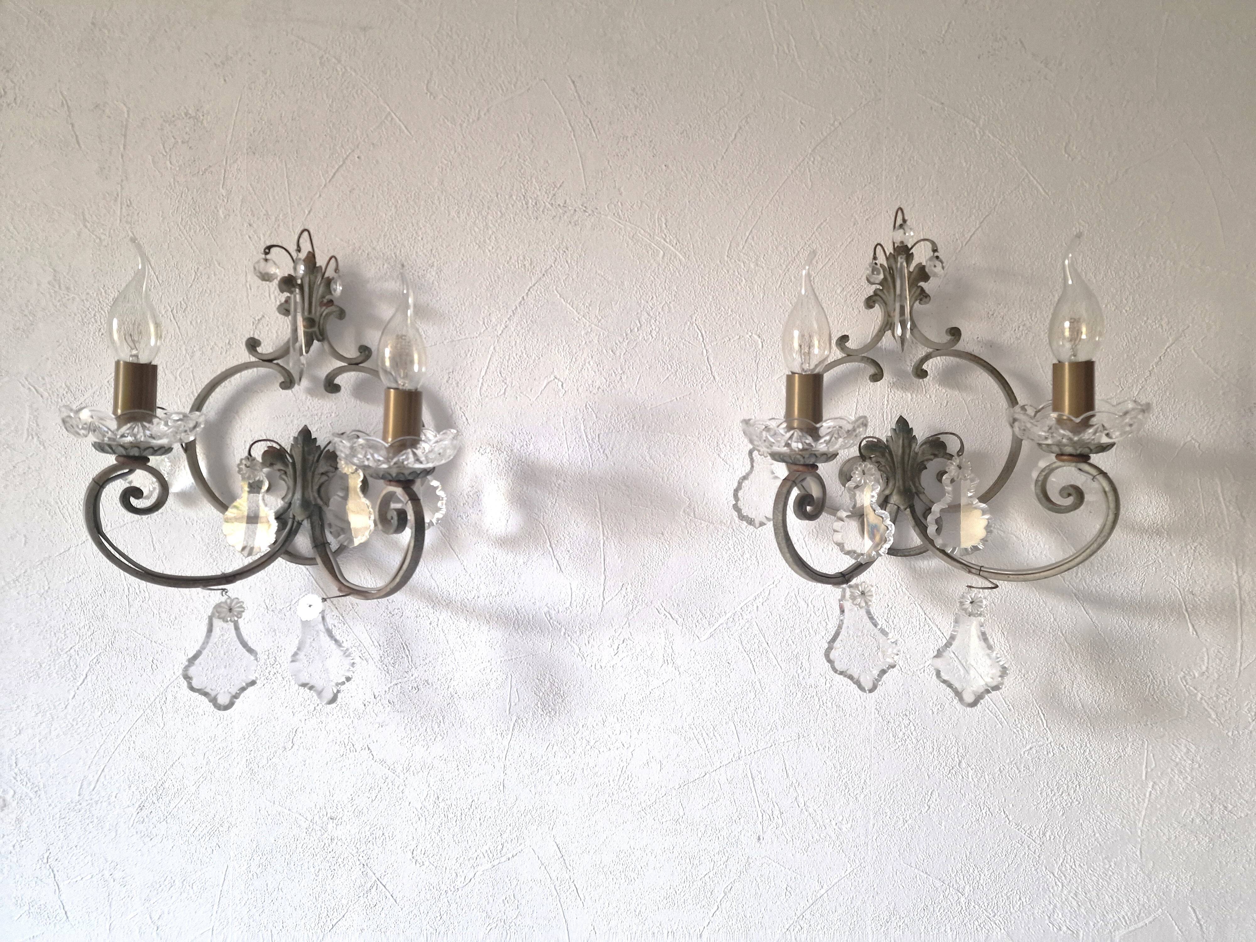 Pair of sconces in patinated metal and crystal tassels