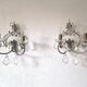 Pair of sconces in patinated metal and crystal tassels