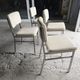 4 chrome metal chairs with faux leather from the 1970s.