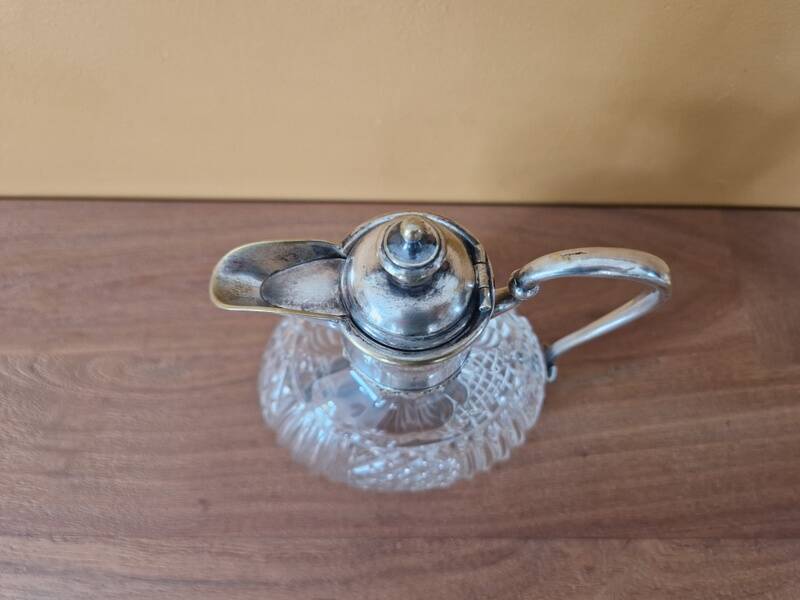 Cut crystal carafe and silver-plated metal