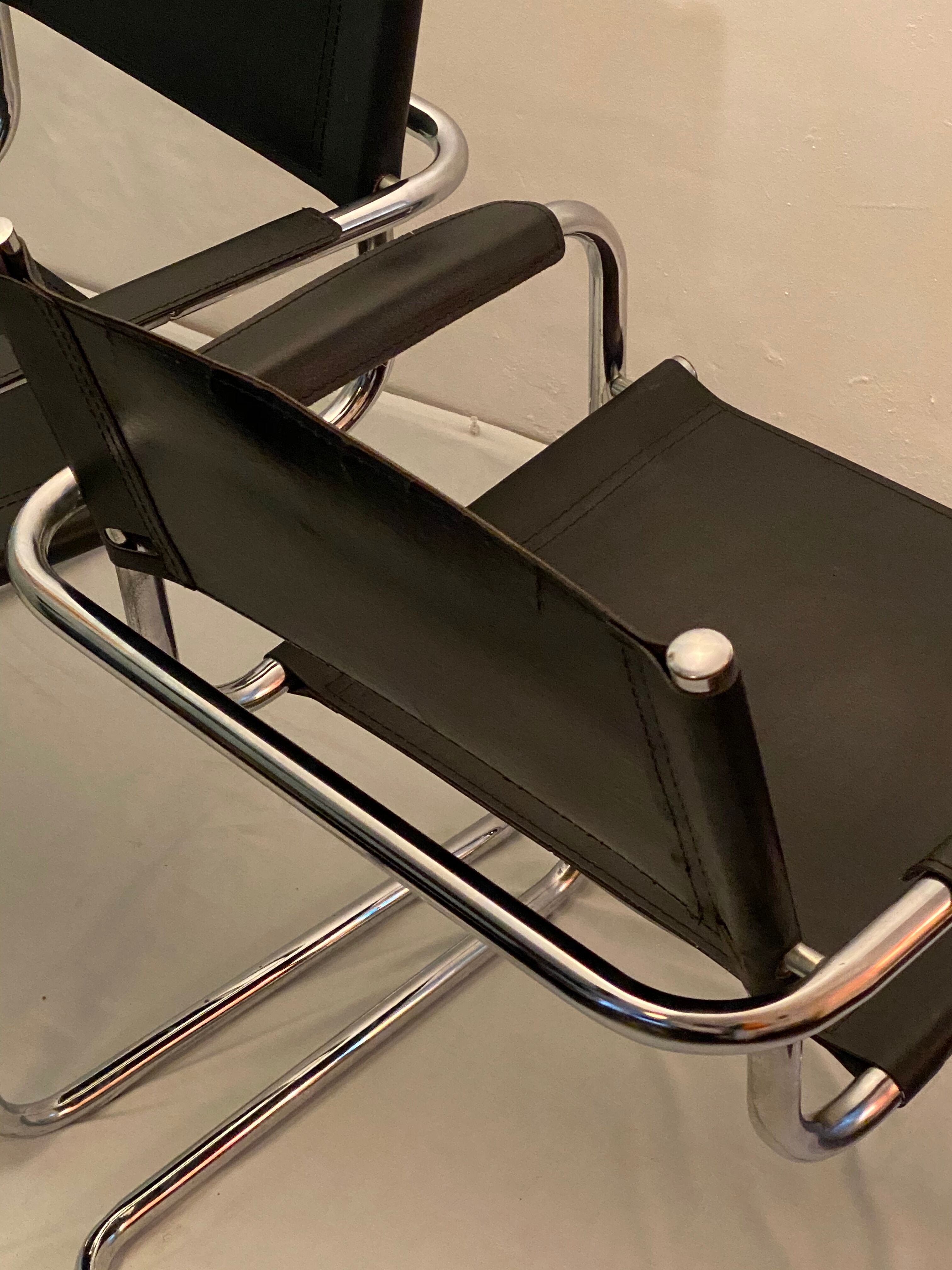 Pair of chrome and leather tube chairs