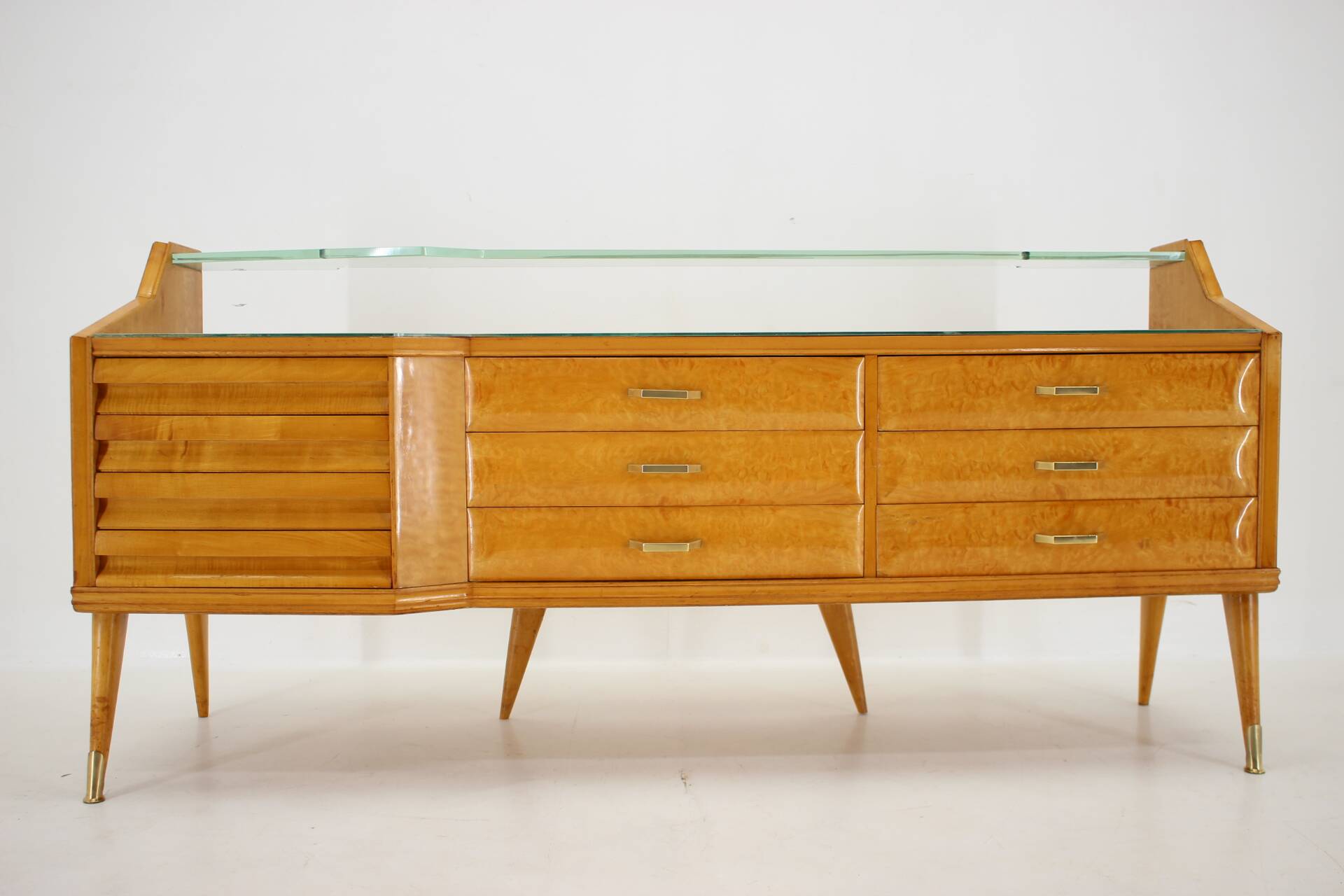 1960s italian sideboard/chest of drawers in high gloss finish with glass top and shelf