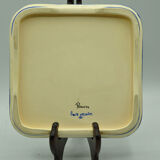 Under the plate and bottle signed Rouen collection art of the table