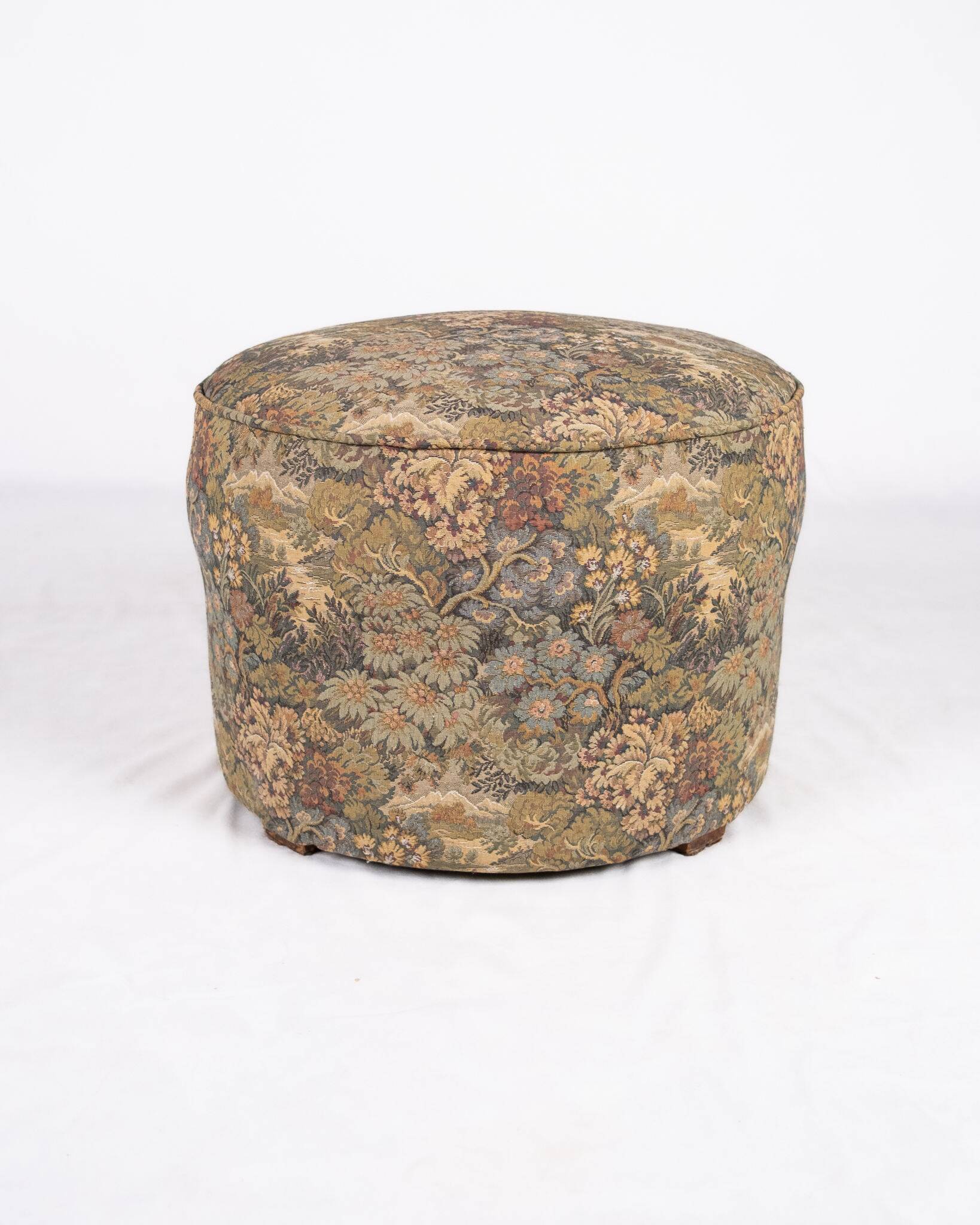 Upholstered pouf in verdure tapestry style, France, late 19th century.