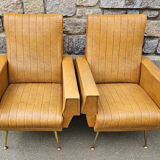 Pair of mustard skaï armchairs, brass feet