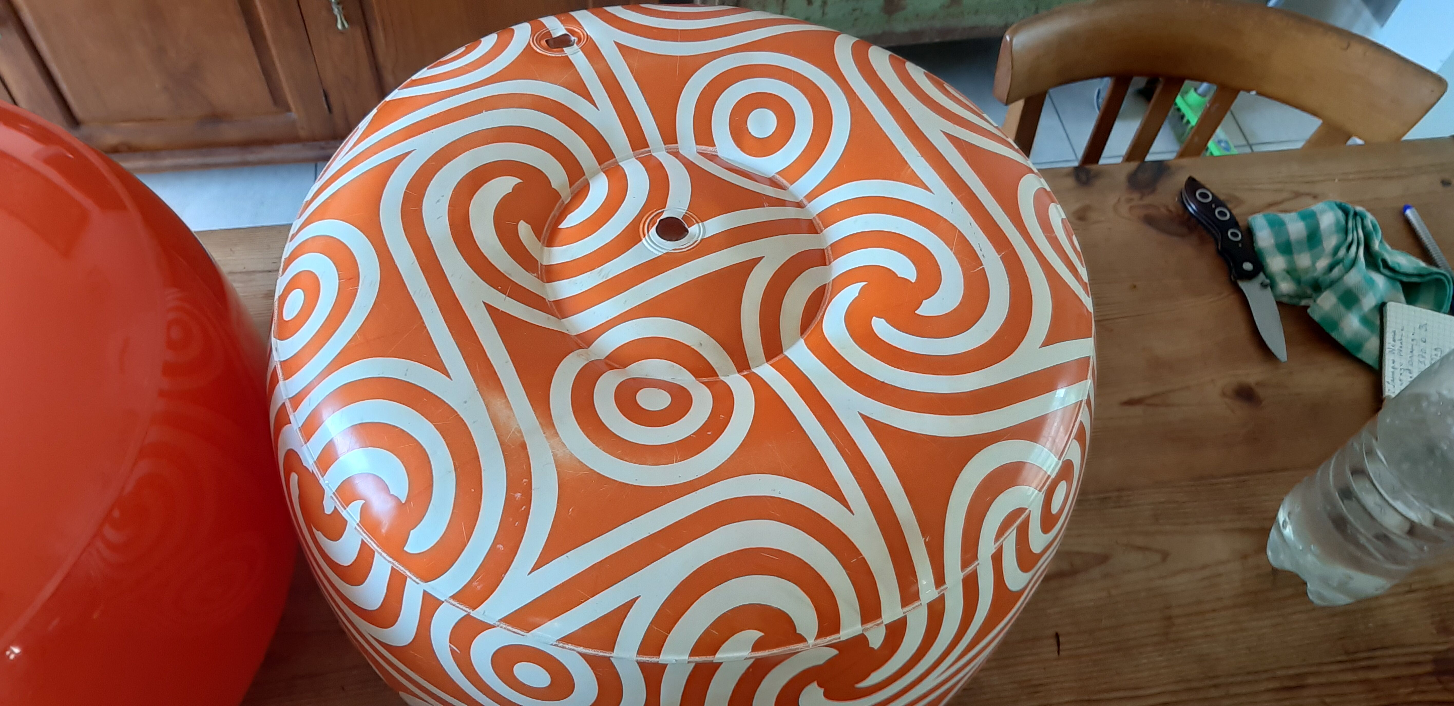 2 vintage inflatable poufs in orange plastic