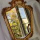 Miroir en bois doré décoré