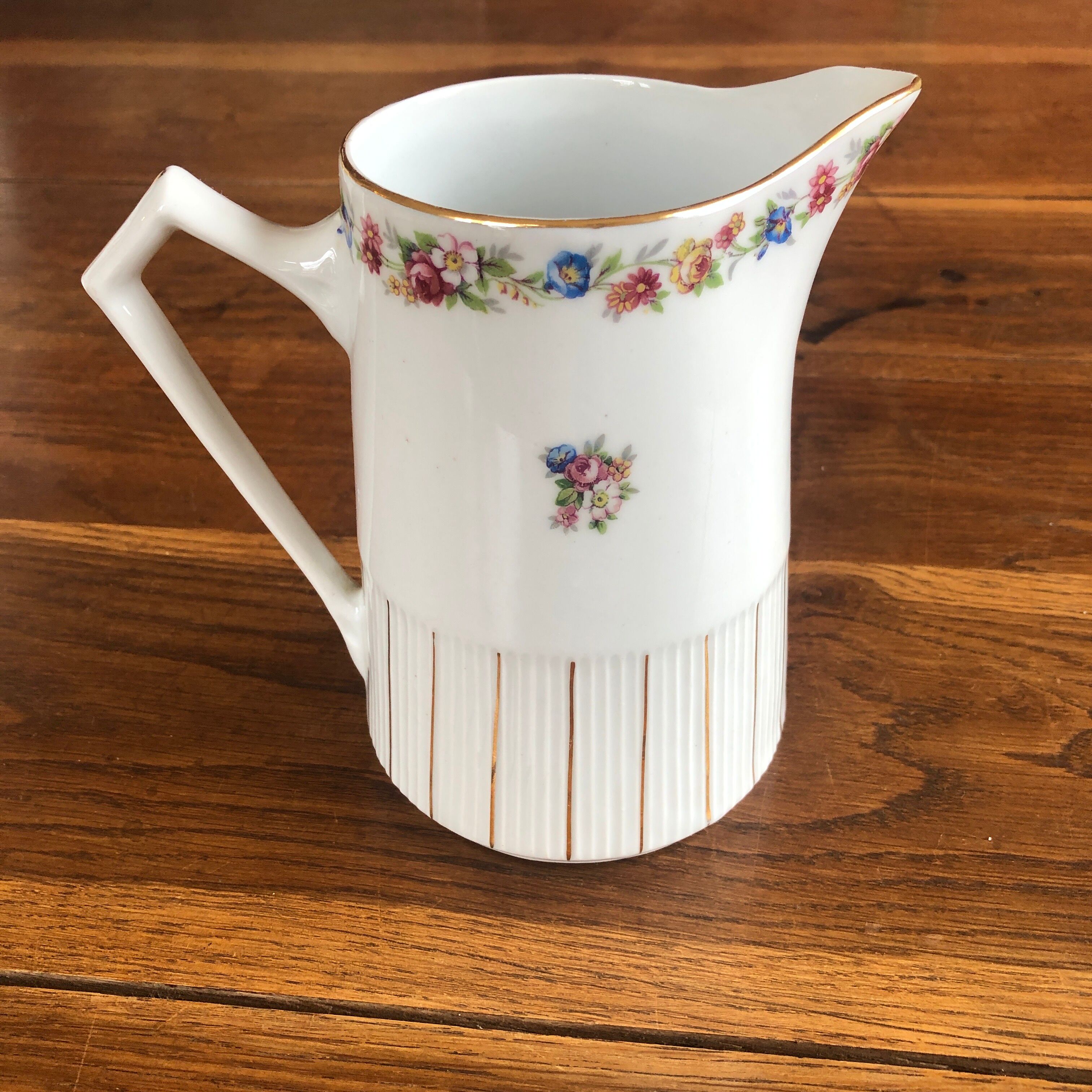Porcelain pitcher with flowers
