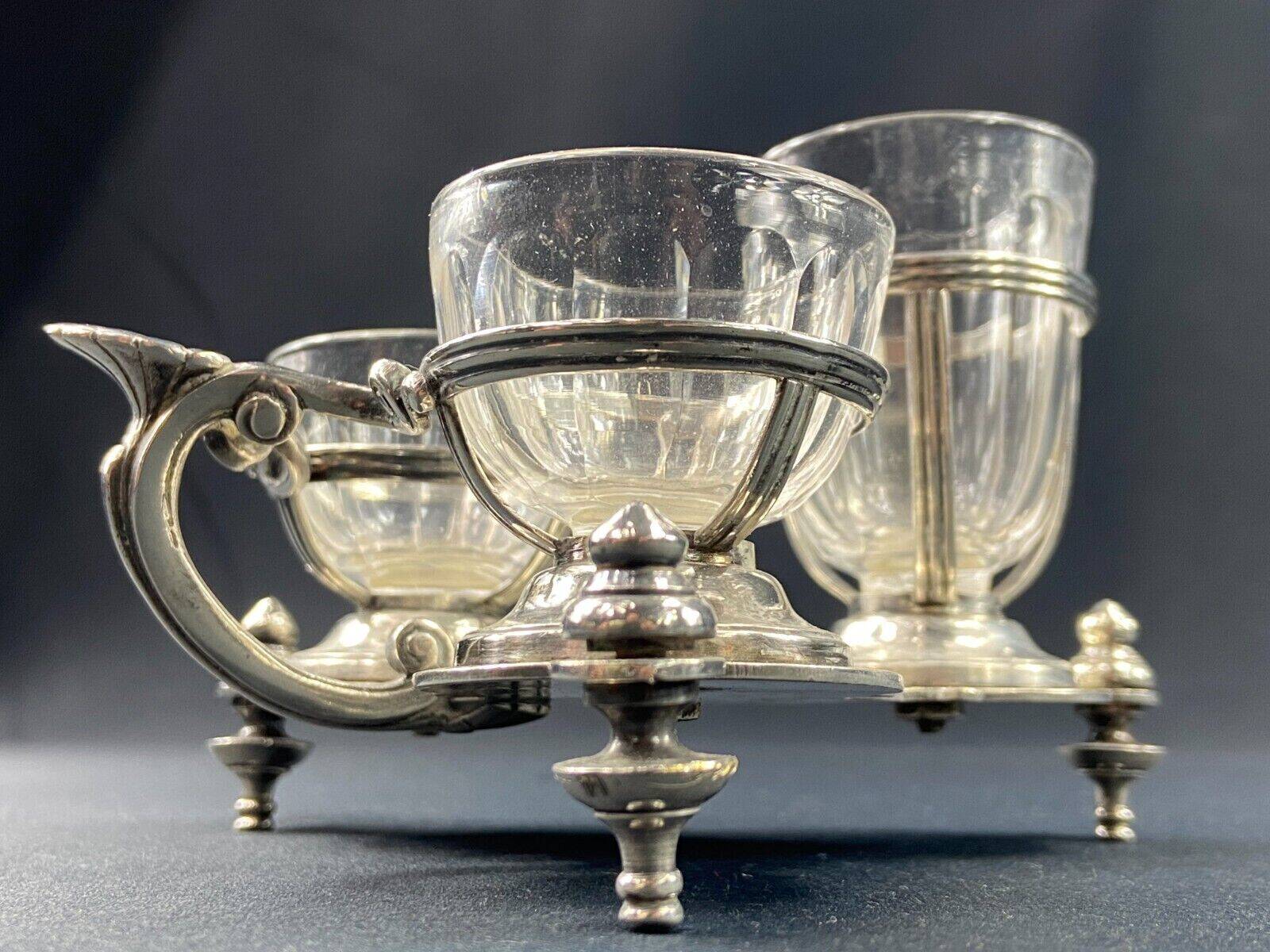 Porte salerons moutardier métal argenté et cristal XIXe décor coquille Louis XV