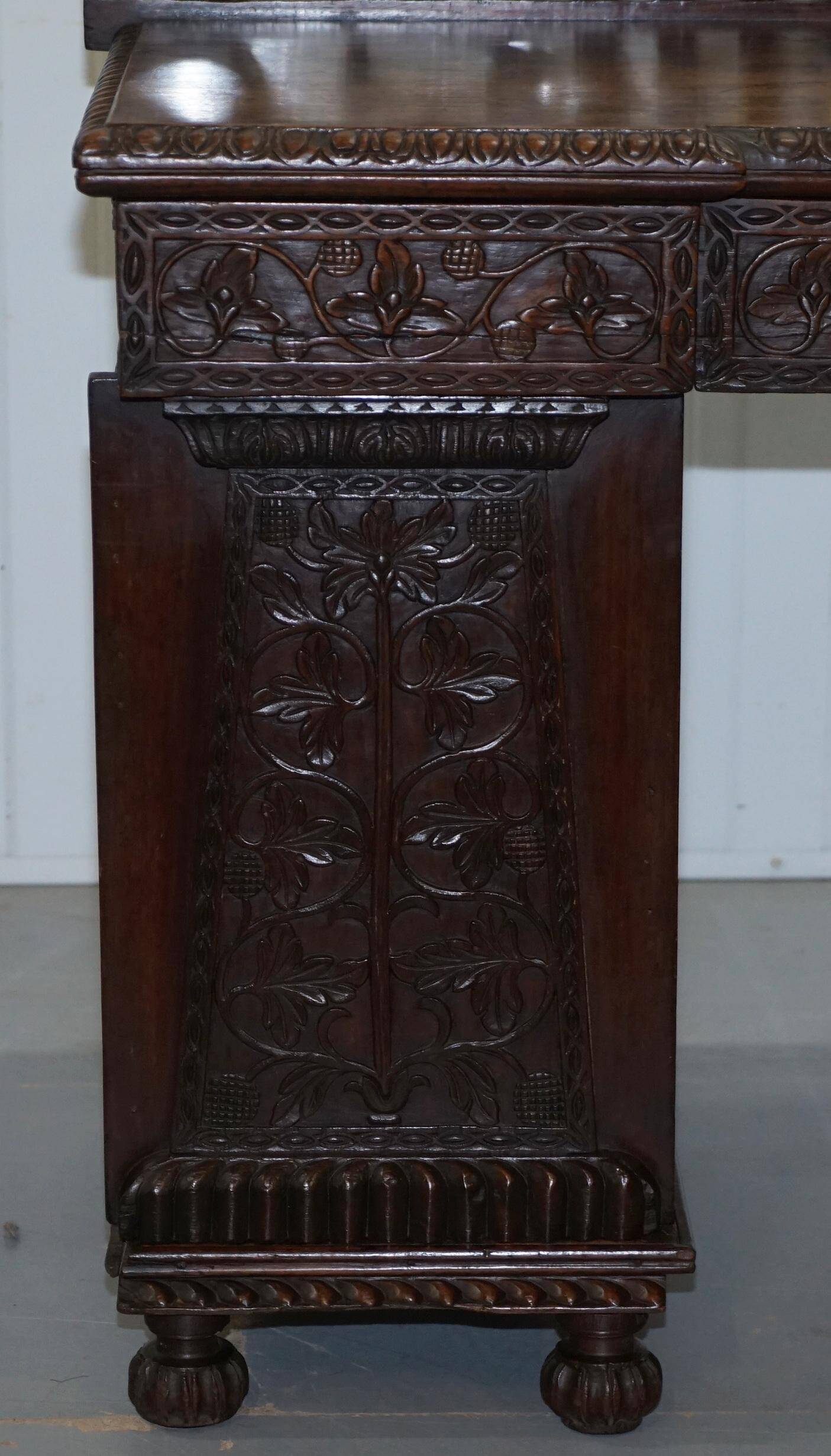 19th-century hand-carved Anglo-Burmese buffet with drawers and cupboards.