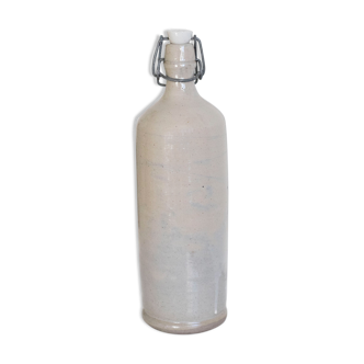 Bottle of enamelled stoneware hot water bottle